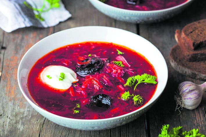 Traditional borscht with prunes and sour cream